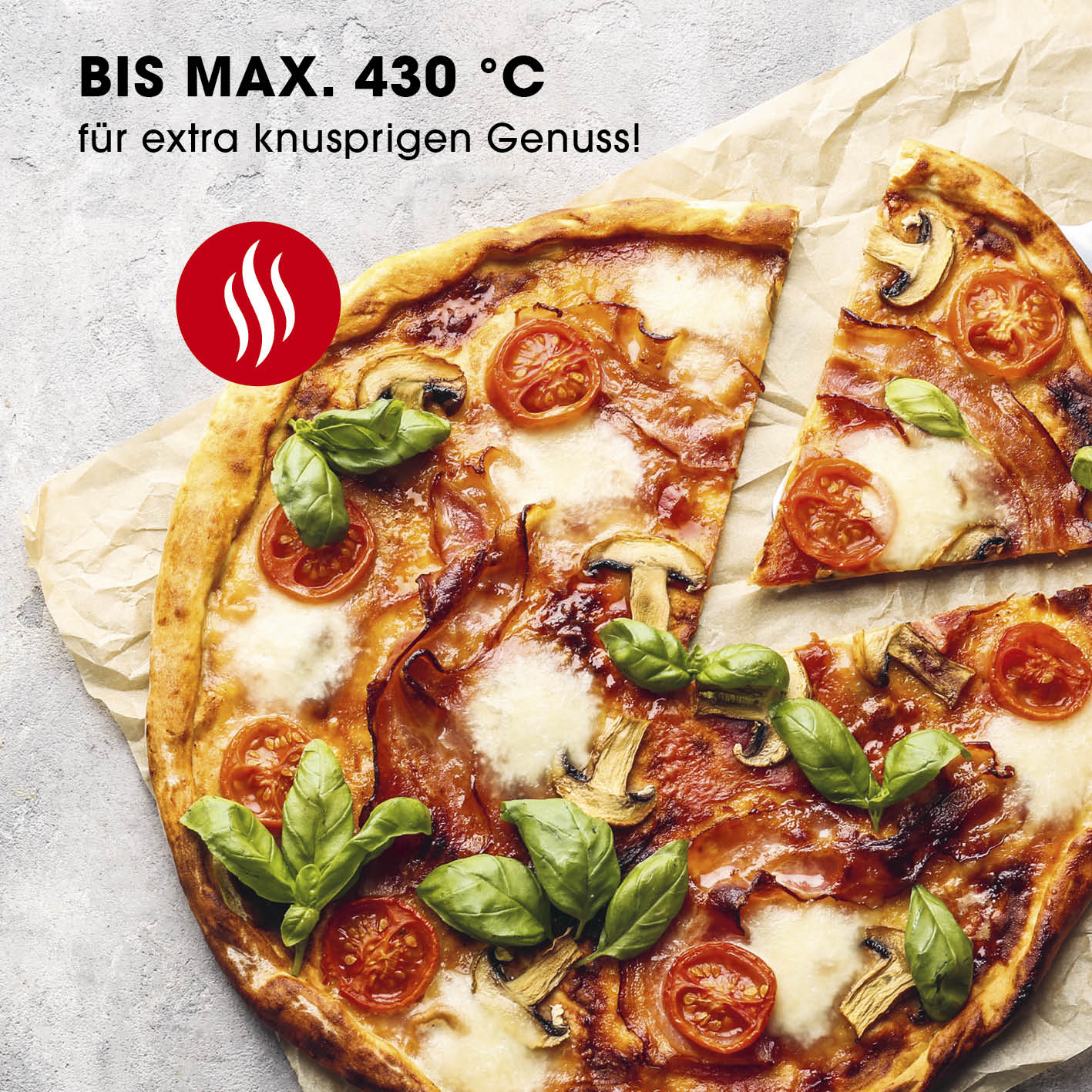 Elektro-Pizzaofen mit Pizzaheber zeigt knusprige Pizza mit frischem Basilikum, gebacken bis 430°C für perfekten Genuss.