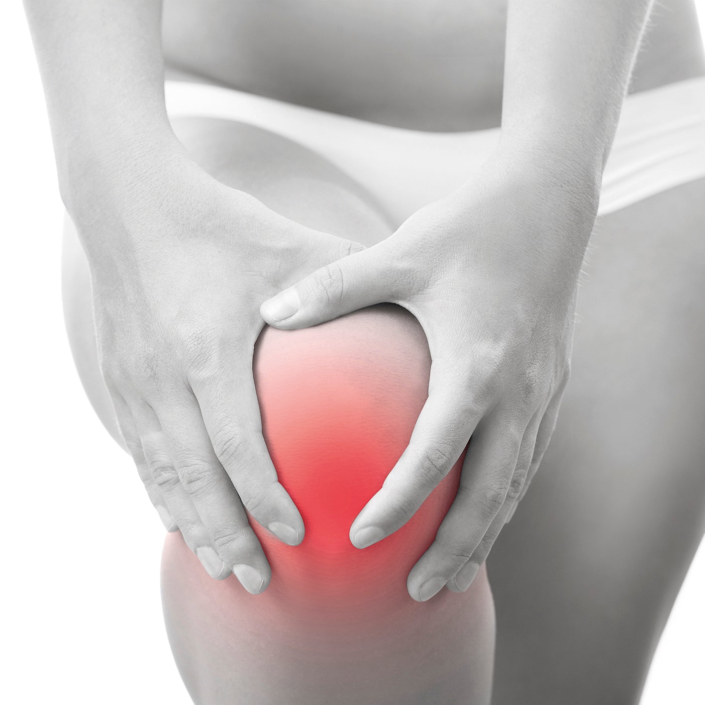 Person hält schmerzendes Knie mit roter Markierung zur Darstellung von Schmerzen für Schmerztherapie-Gerät Ultraschall Anwendung.