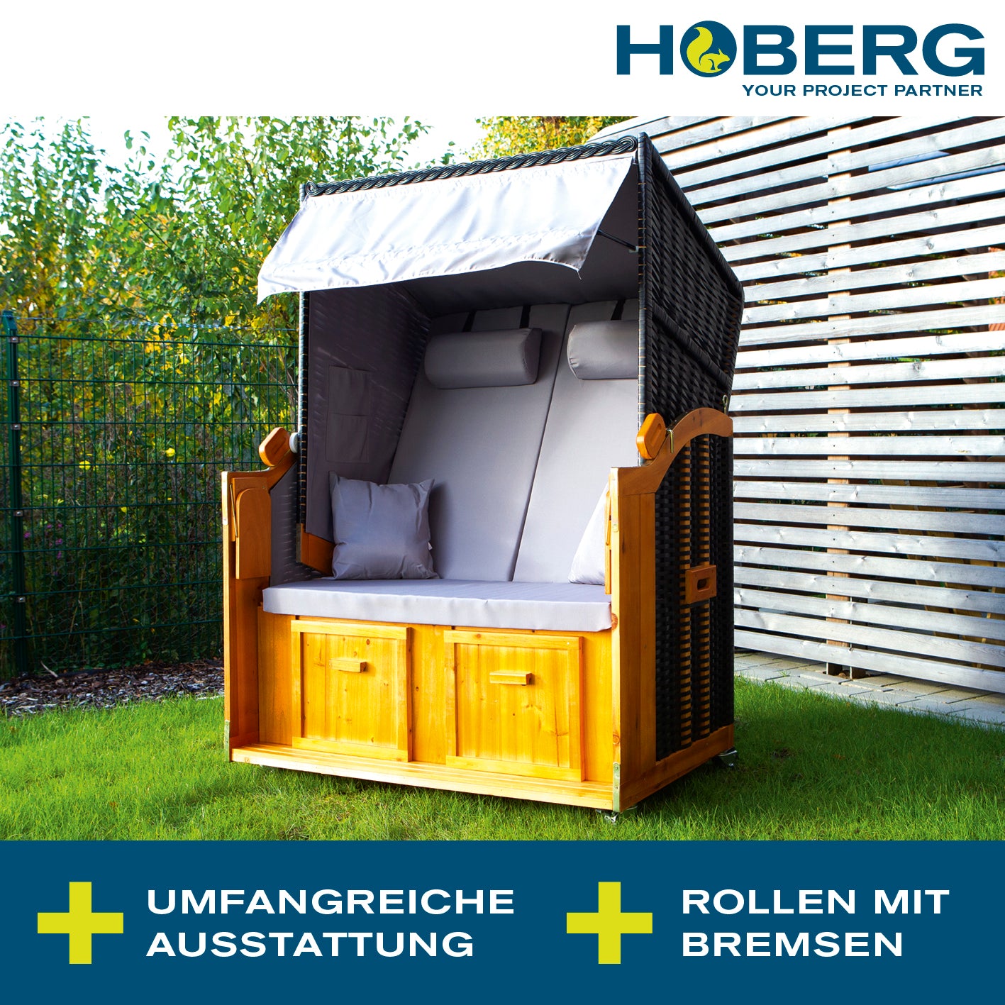 2-Sitzer-Strandkorb (Ostsee) grau/braun aus Hartholz mit PE-Geflecht, Nackenrollen, Fußbänken und klappbaren Tischen.