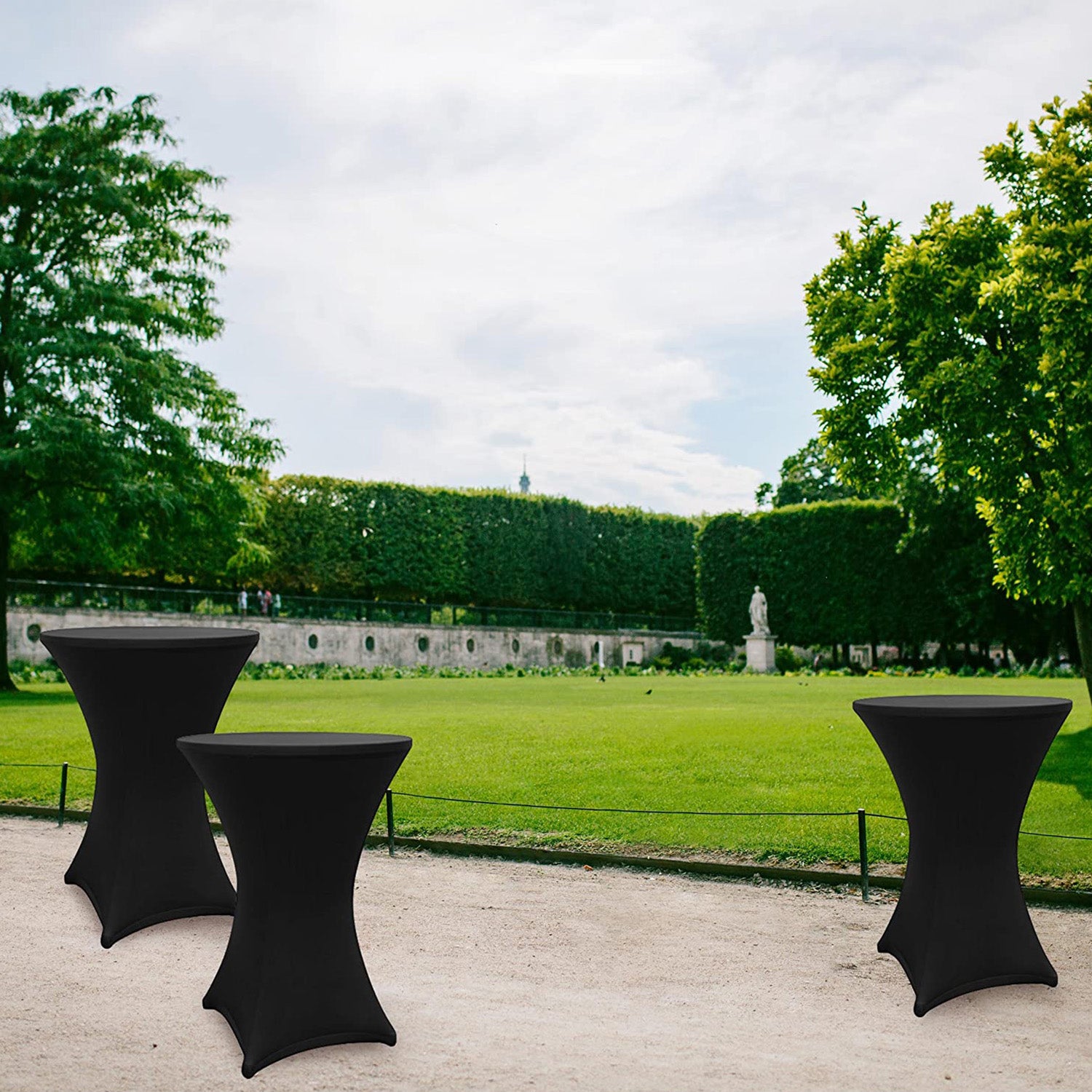 Stehtischhusse - Tisch Bezug - Husse - Ø 80-85 cm - Schwarz - 5er-Set auf Stehtischen in Parkumgebung, elegante Passform und Materialqualität.