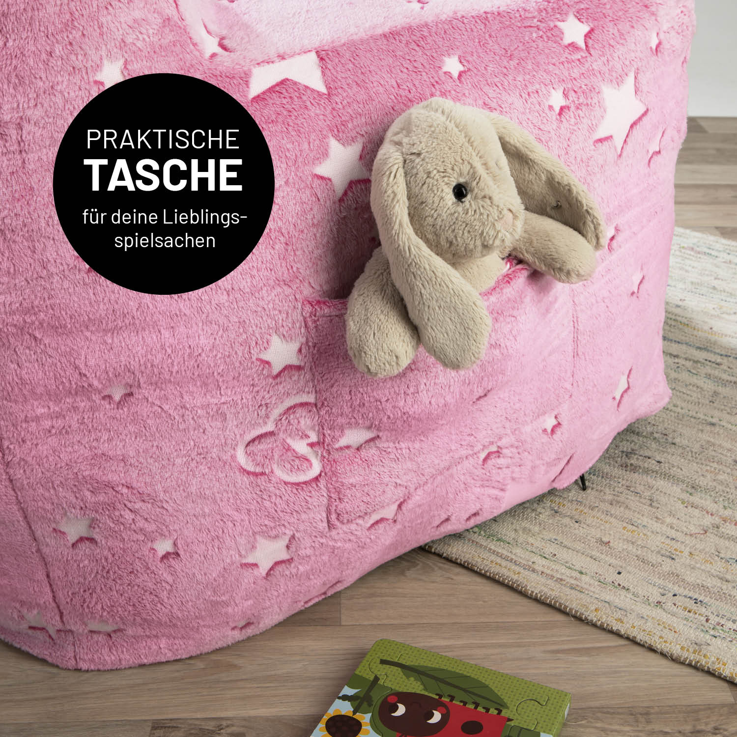 Sessel „Glow in the Dark“ - Pink mit praktischem Fach für Spielzeug und verspieltem Sternen-Design, das im Dunkeln leuchtet.